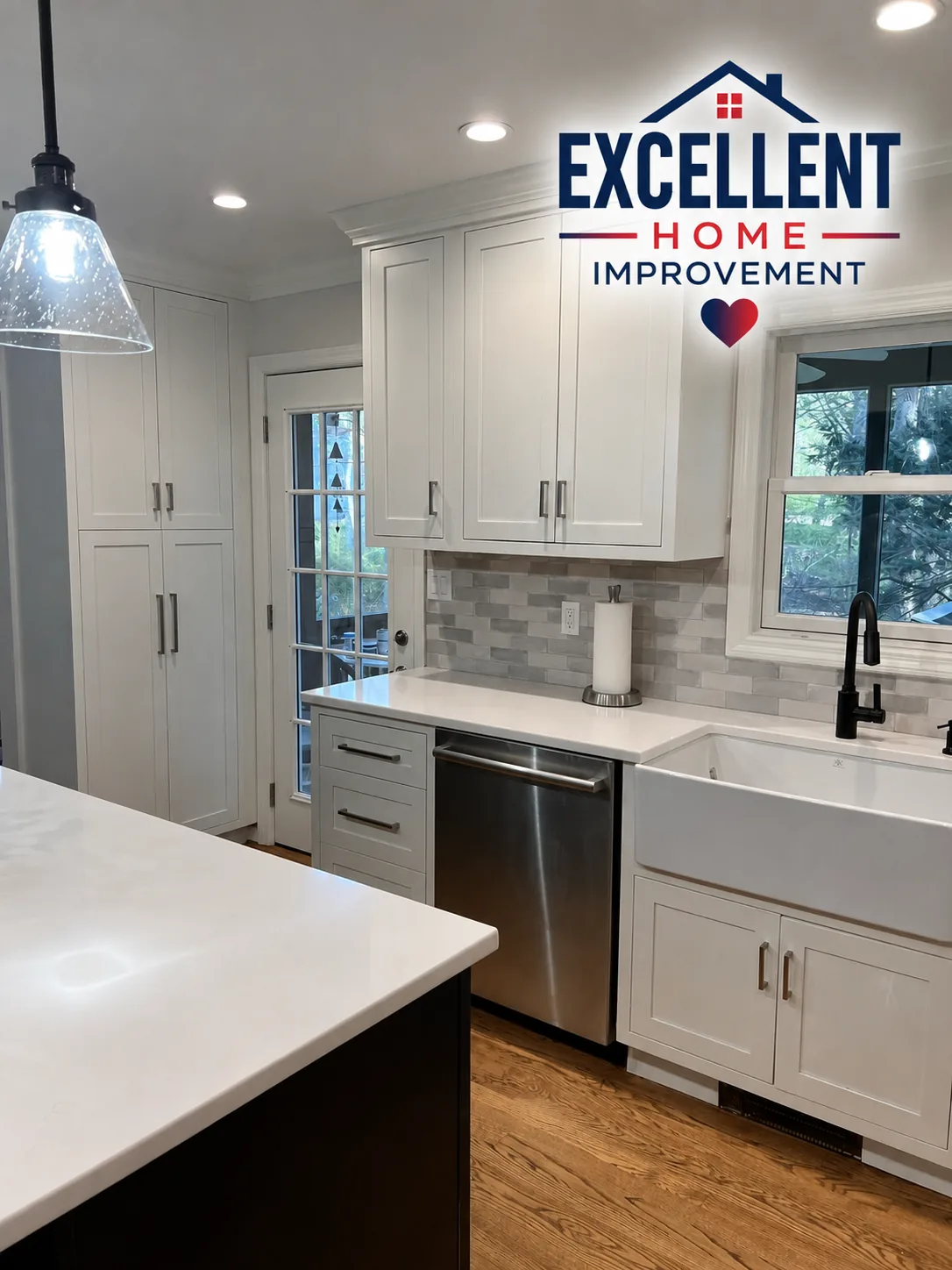 Kitchen renovation with farmhouse sink, quartz island and shaker cabinetry