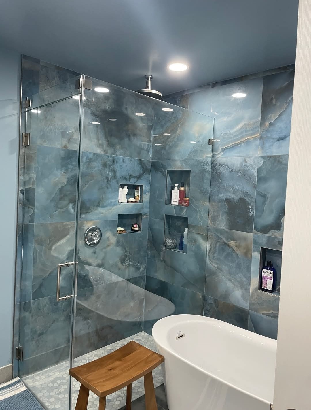 Completed bathroom renovation project in NYC with updated shower and vanity