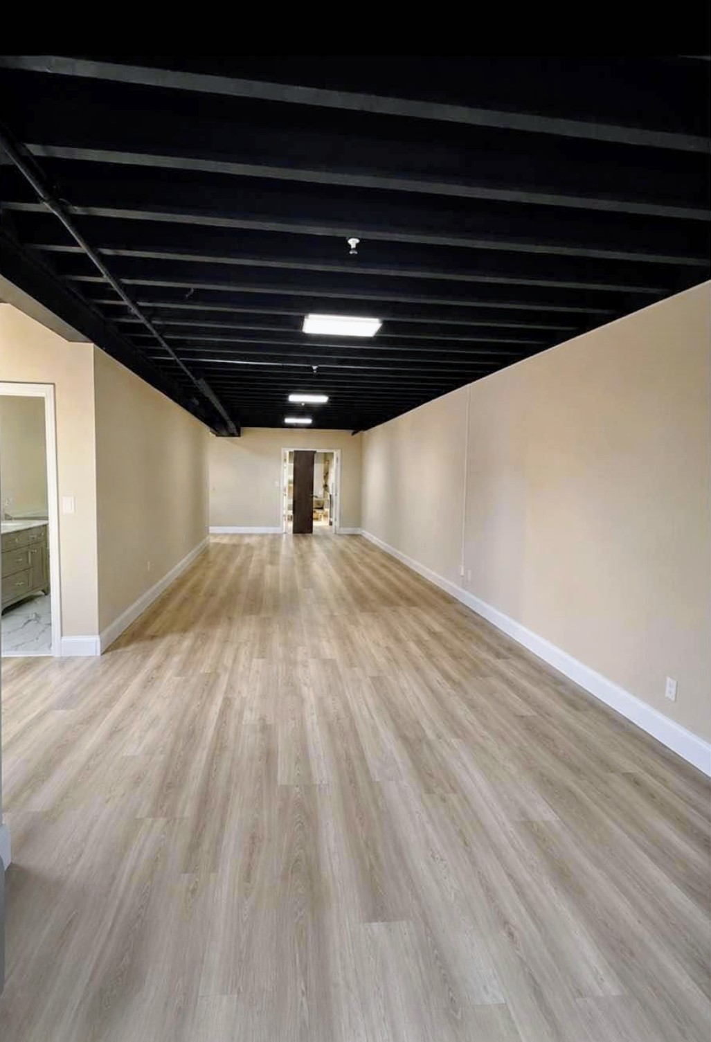 Finished basement renovation in the Bronx with new framing, drywall and recessed lighting