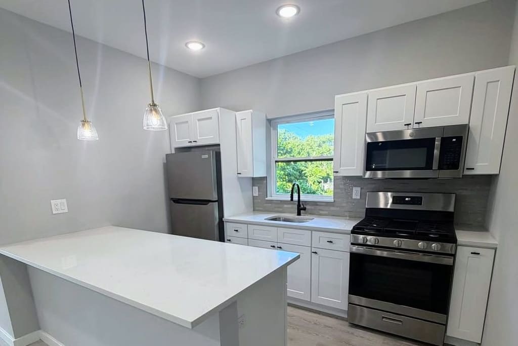 Renovated Bronx kitchen with custom cabinets and quartz countertops